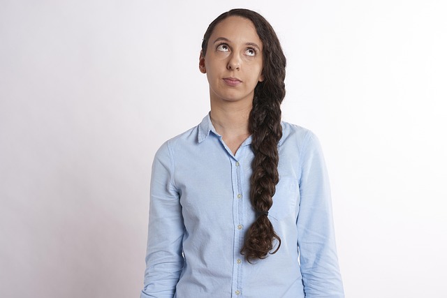 Person frustrated by scrolling through streaming service menus (entertainment ideas for home)